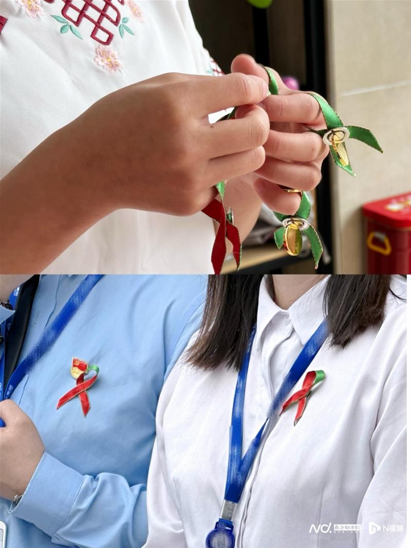 临汾红丝带学校的孩子们给每位来宾都佩戴上了红丝带胸针_副本.jpg